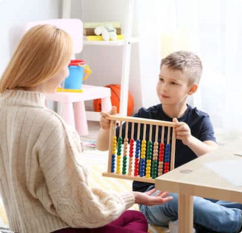 Young child playing with therapist